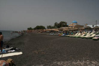 Black_volcanic_sand_beach_Kamari_Santorini